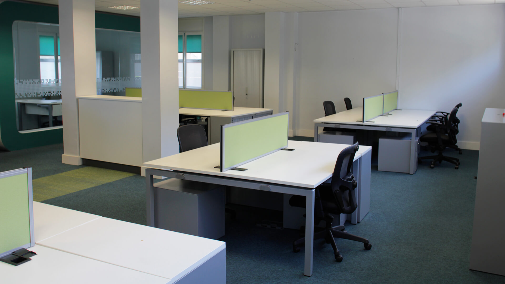 A large, open-plan office space in the OneFiveSeven building