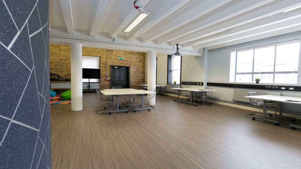 The tables in iD8 studio are arranged in a way that is suitable for group work.